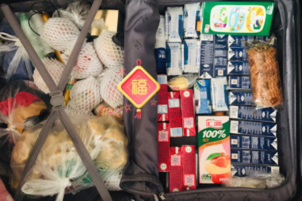 行李箱塞满爱 破译了故乡文化基因的密码